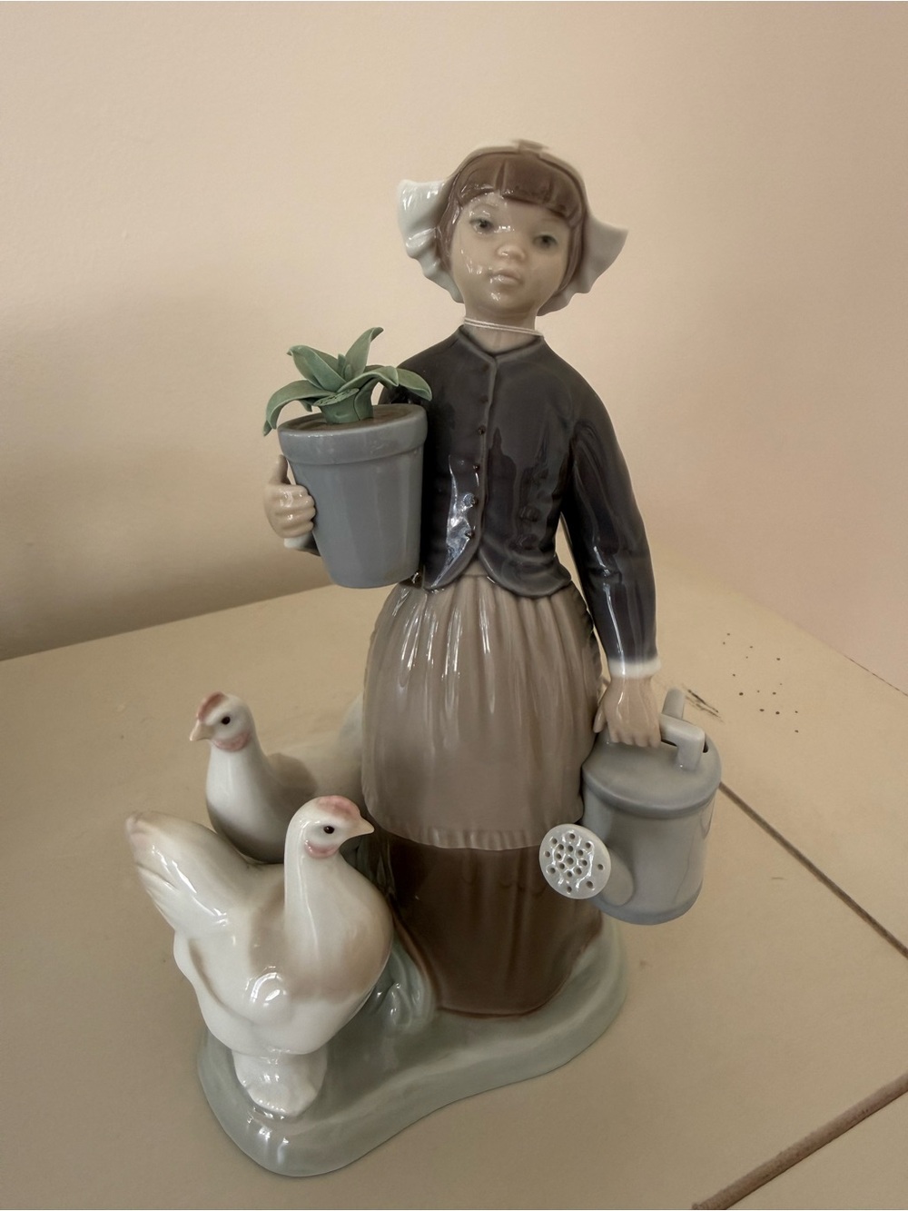 Lladro Porcelain Farm Girl Figurine in Cream, Gray, and Brown